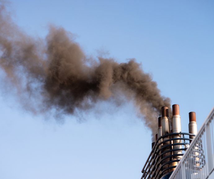 Ship funnels emitting black smoke